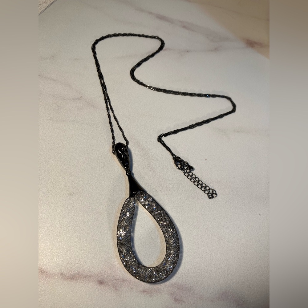 Long statement necklace ‘ Zara’. Executed in hematite. Snake chain.